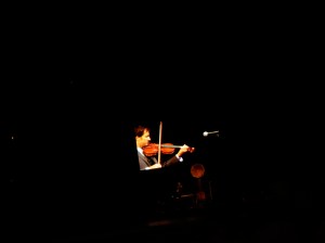Andrew Bird against the backdrop of the beautiful Pritzker Pavilion.